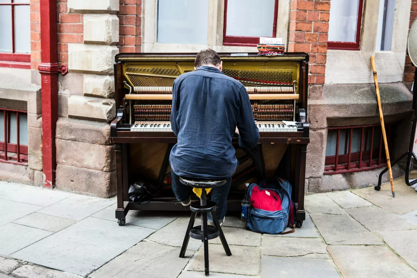 Man playing upright piano