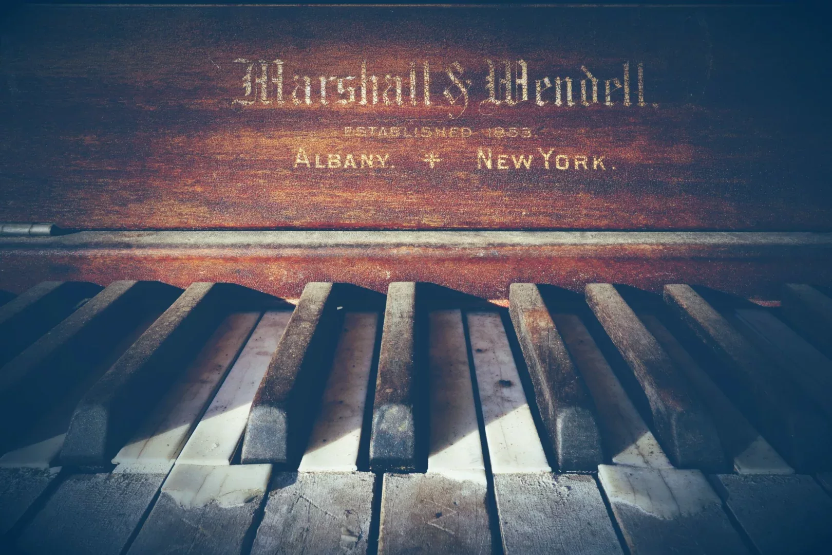 old piano albany + new york, top down, rusty cracked keys.